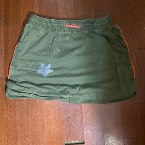 Green Skirt with Star Patch and Orange Trim